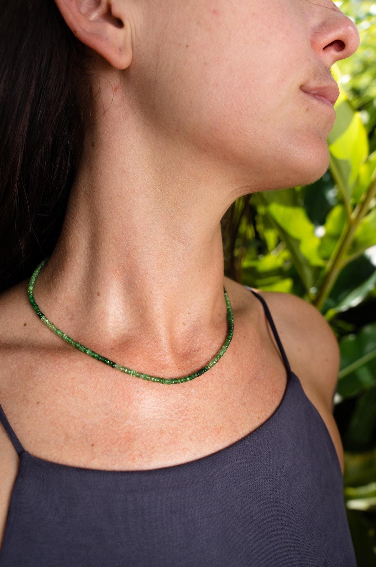 Tsavorite ombre necklace with vibrant green gemstones arranged in a graceful cascade, designed by Earthly Abundance.