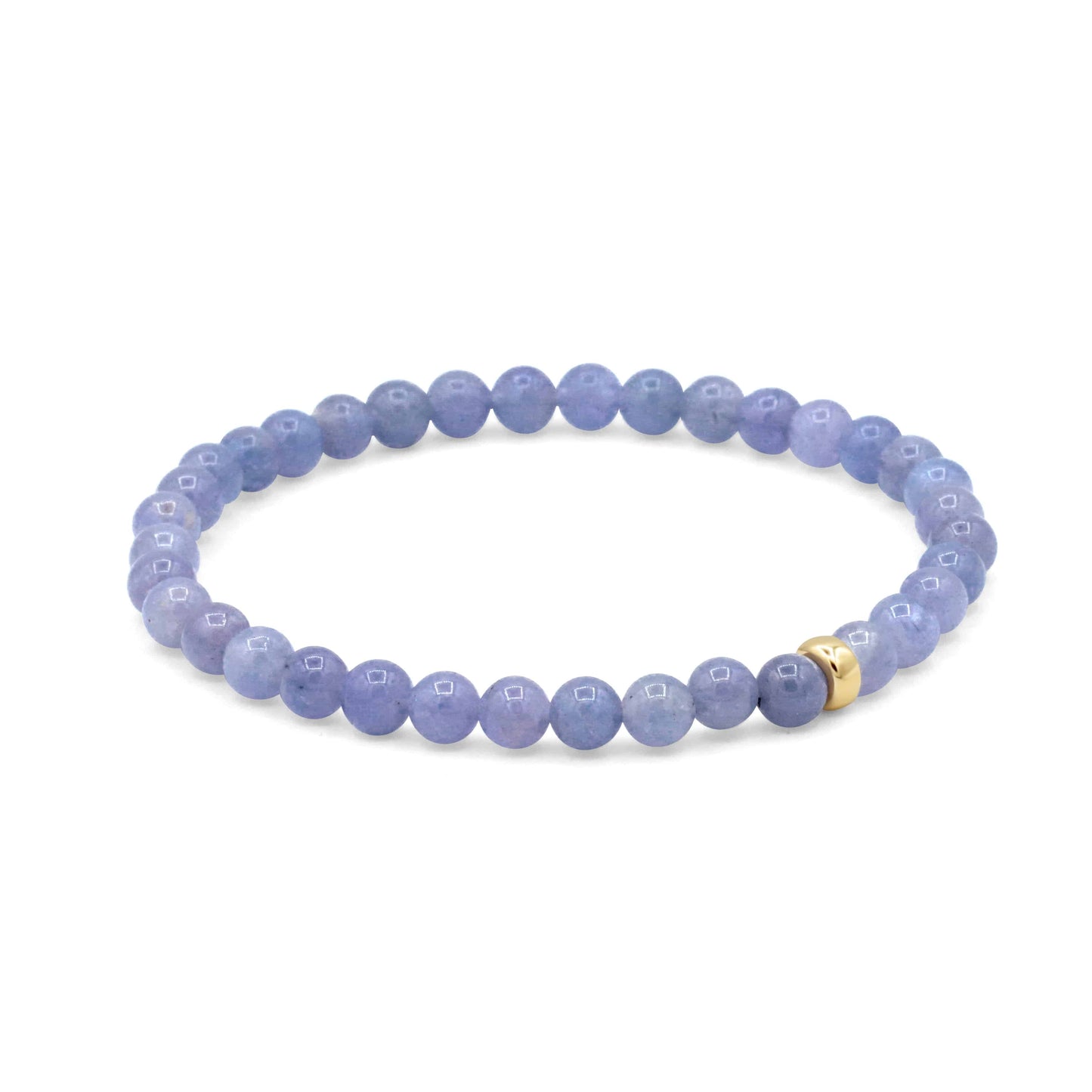 Tanzanite bracelet with 14K gold setting from Earthly Abundance Jewelry, featuring deep blue-violet gemstones on a delicate chain.
