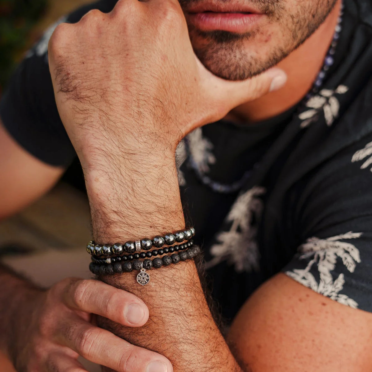 Earthly Abundance Rooted Strength bracelet stack featuring layered beaded bracelets with earthy tones and natural stone accents.