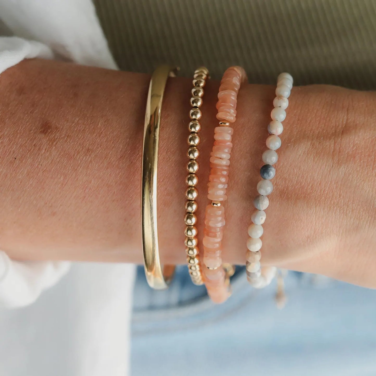 Earthly Abundance Peachy Glow Moonstone bracelet featuring smooth moonstone beads and a delicate clasp.