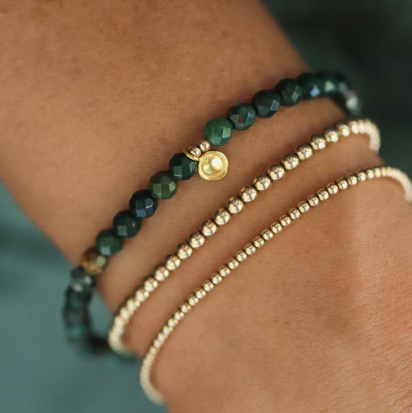 Bloodstone bracelet from Earthly Abundance Jewelry featuring polished beads for protection and enhanced intuition.