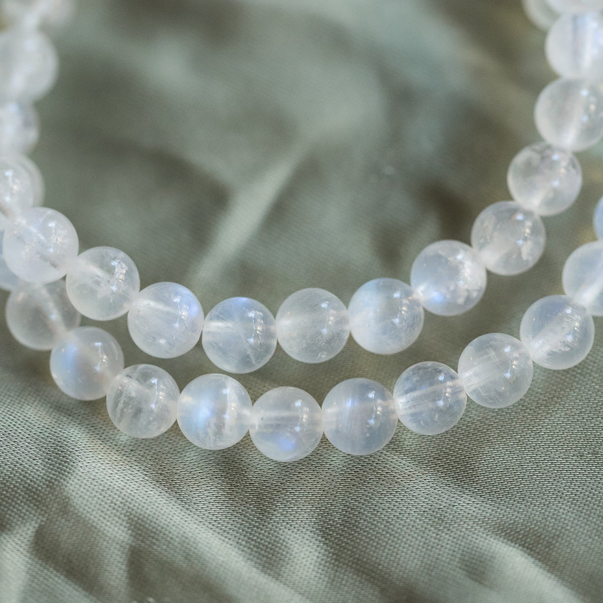 North Star Rainbow Moonstone bracelet with 14K gold accents from Earthly Abundance, featuring polished moonstone beads and delicate design.