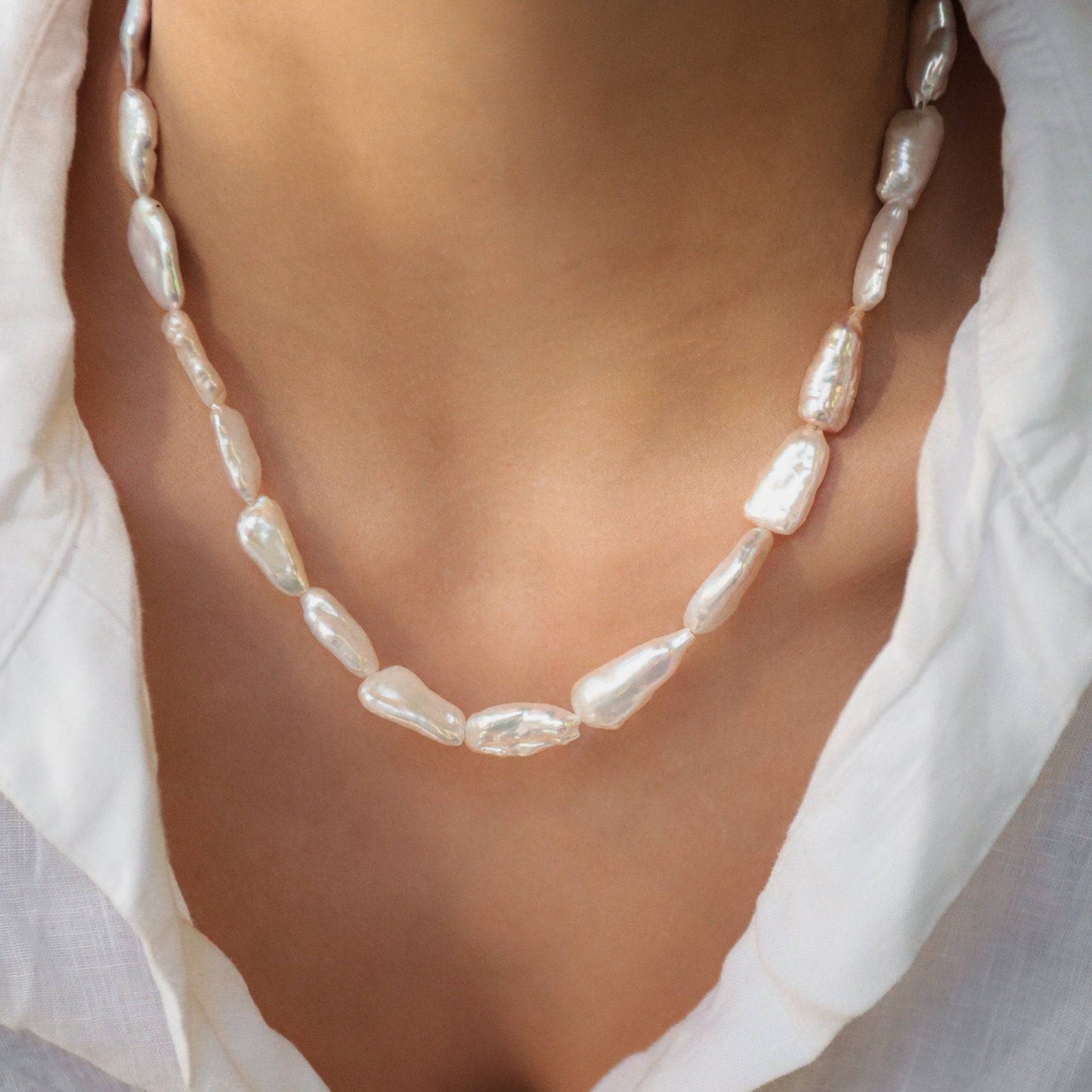 Elegant Keishi Pearl Necklace by Earthly Abundance featuring lustrous white pearls on a delicate chain.