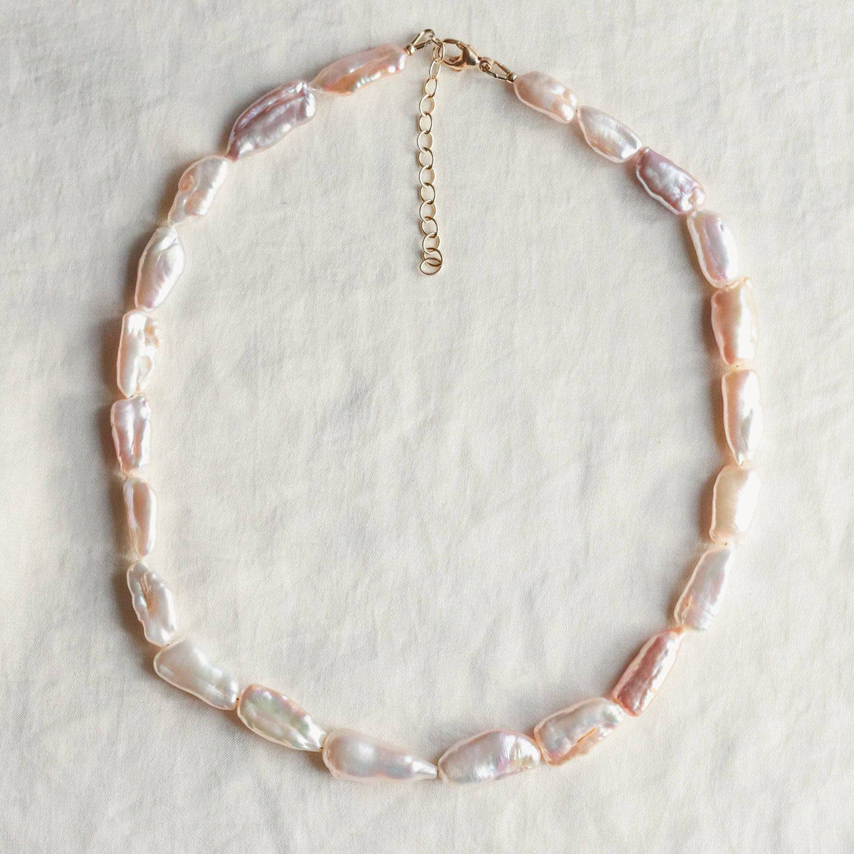Earthly Abundance Keishi pearl necklace featuring lustrous white pearls on a delicate chain.