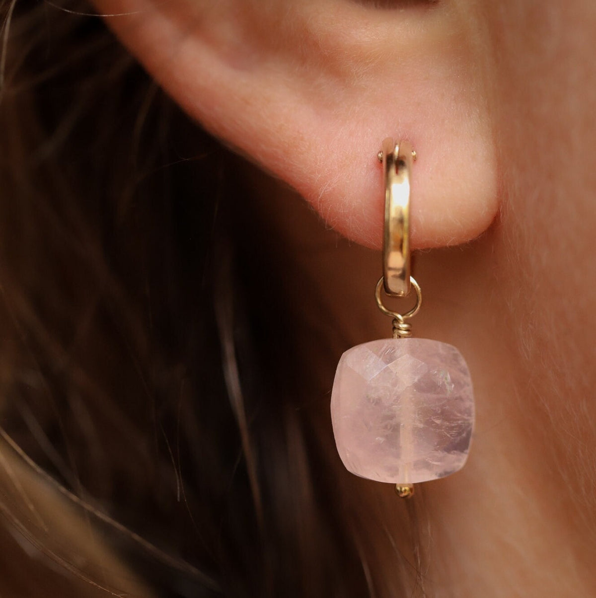 Rose quartz hoop earrings by Earthly Abundance featuring round pink gemstone hoops and gold-tone accents.