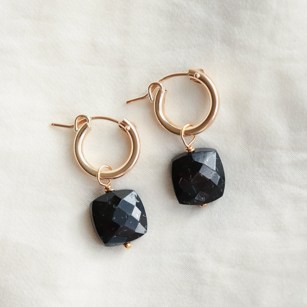 Tourmaline cushion earrings by Earthly Abundance Jewelry featuring vibrant, faceted gemstone dangles with silver hooks.