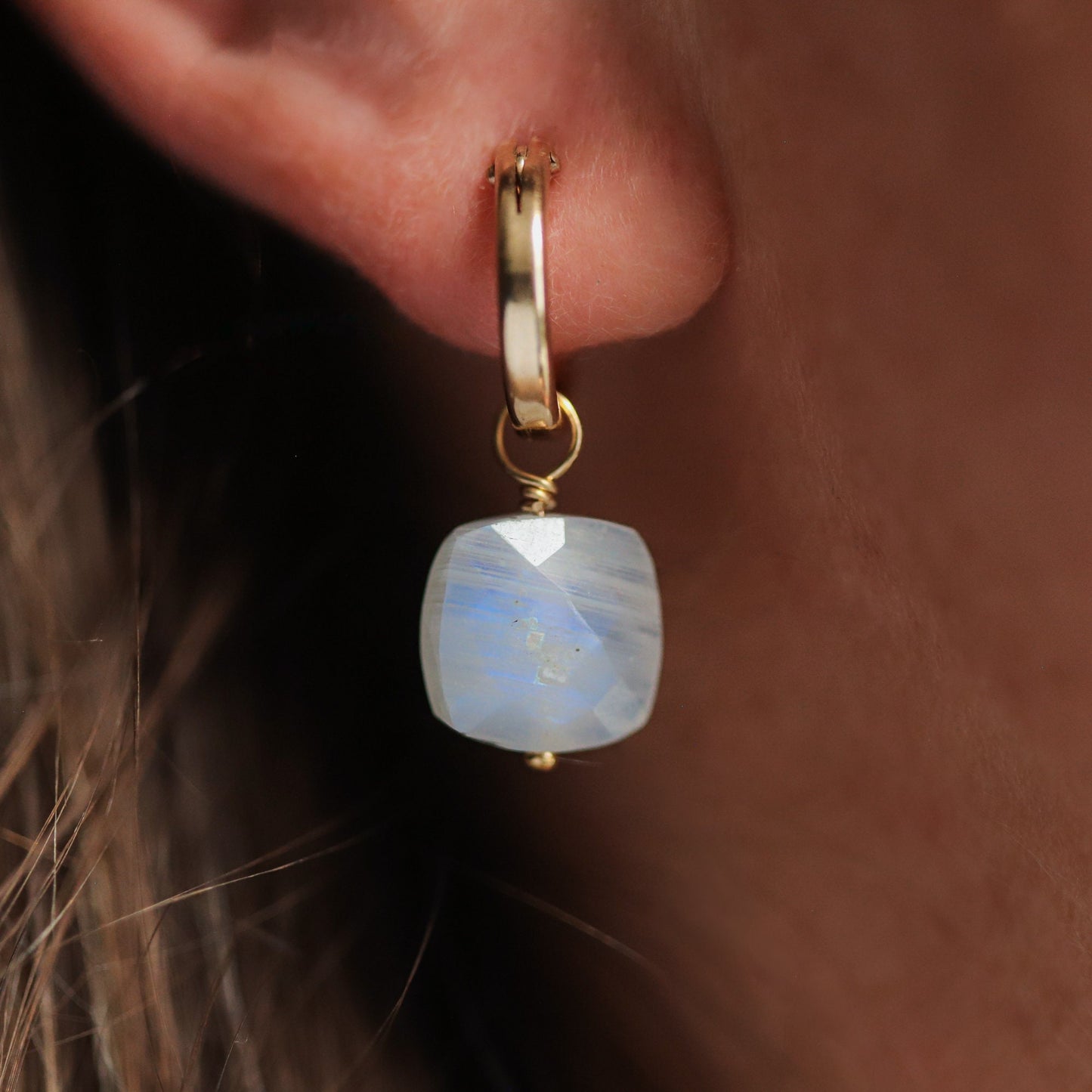 Rainbow moonstone hoop earrings by Earthly Abundance featuring glowing moonstone gemstones in sleek hoop settings.