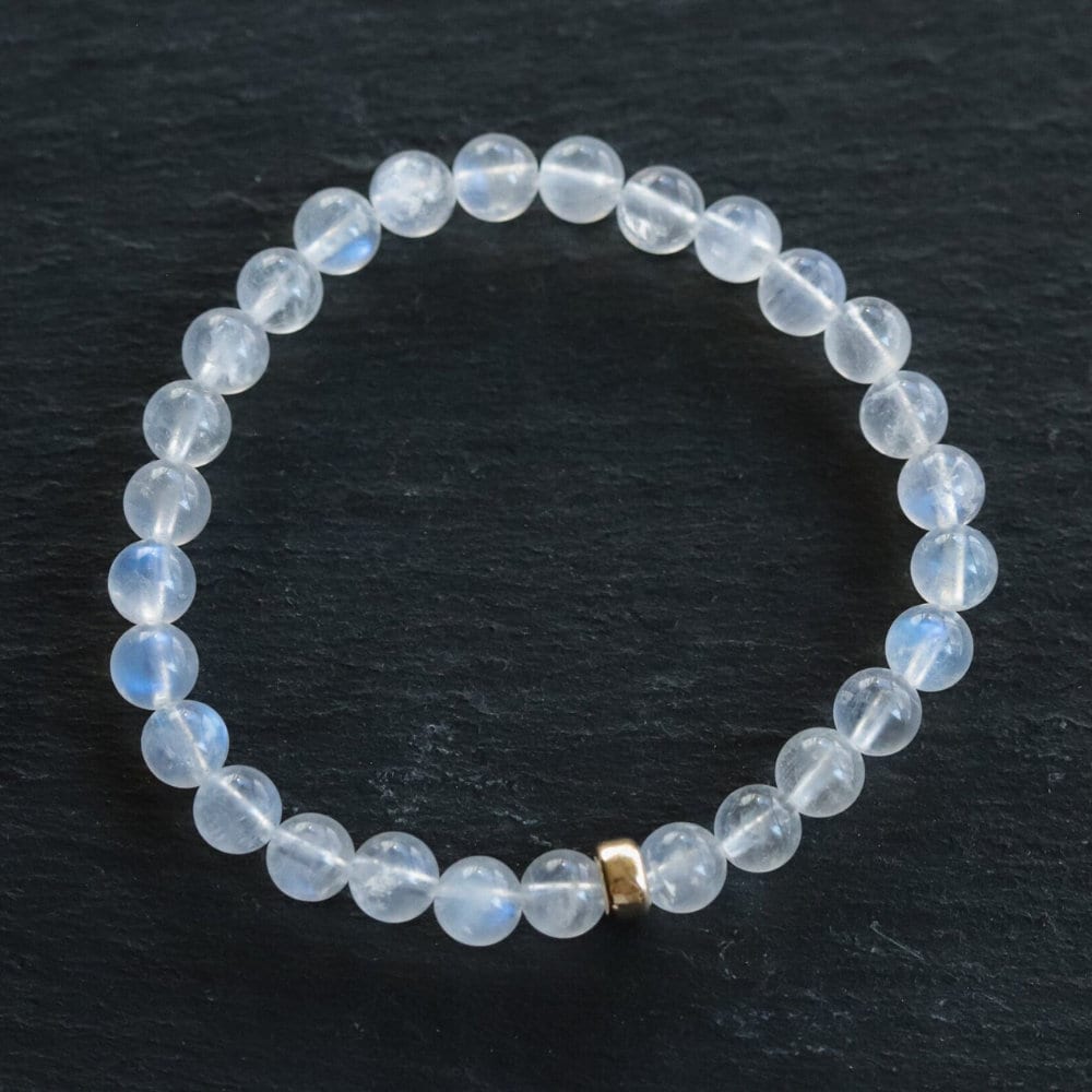 Earthly Abundance North Star Rainbow Moonstone bracelet featuring 14K gold accents, showcasing the iridescent moonstone beads.