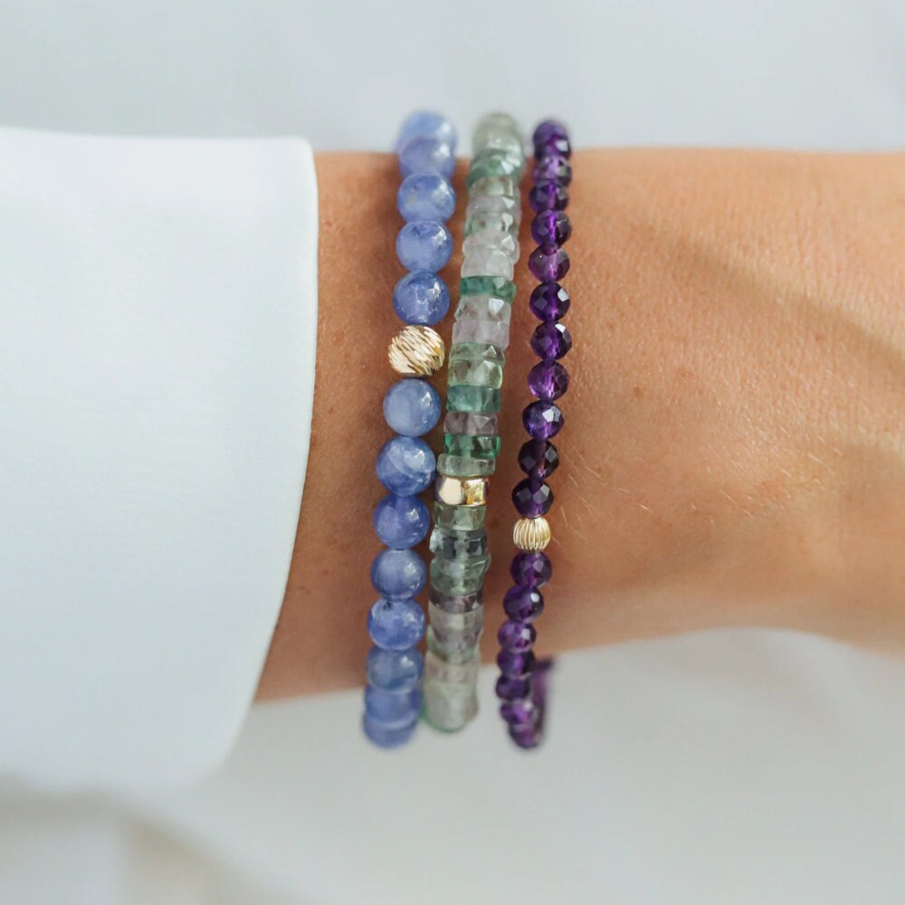 Elegant African Amethyst bracelet by Earthly Abundance featuring polished purple gemstone beads on a delicate elastic cord