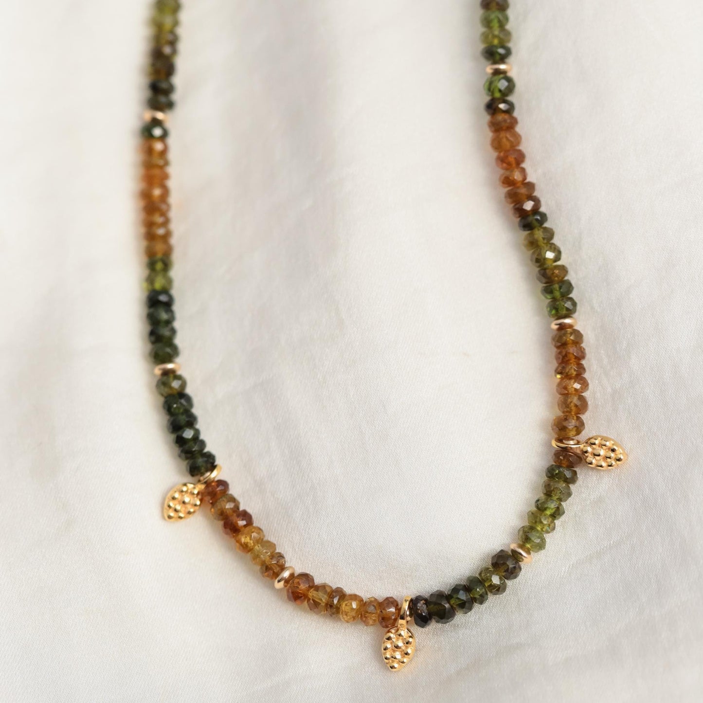 Earthly Abundance Petro Tourmaline necklace with polished pendant featuring vibrant multicolored tourmaline stones on a silver chain