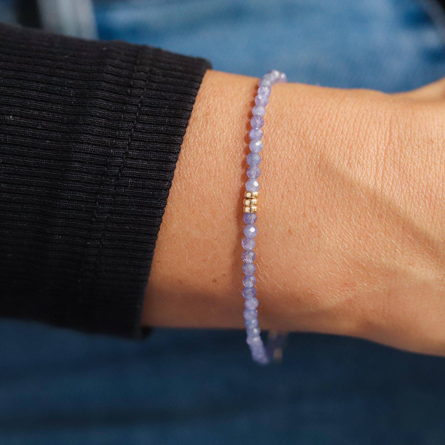 3mm AAA Tanzanite bracelet from Earthly Abundance featuring vibrant blue gemstones on a delicate string.