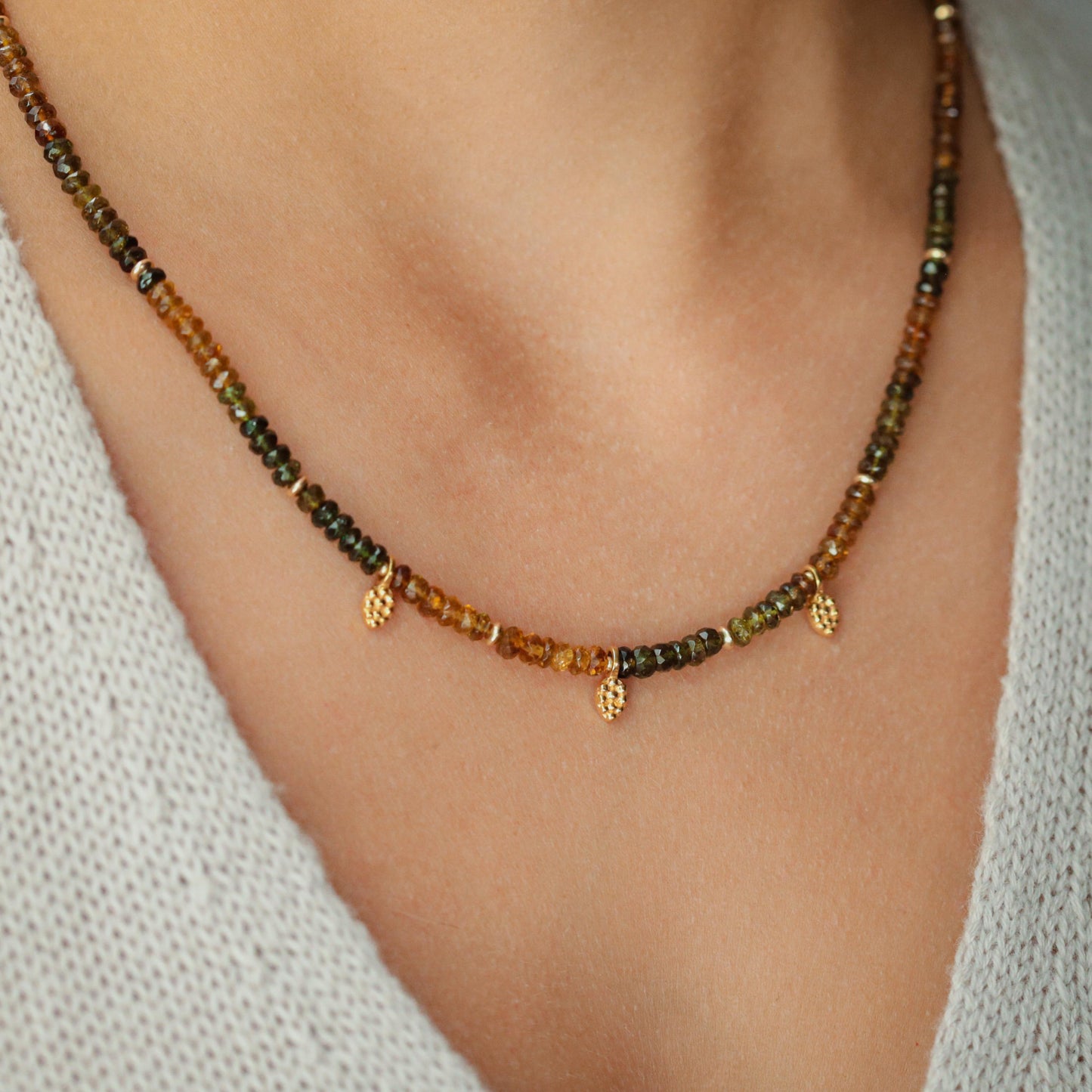Earthly Abundance Petro Tourmaline necklace featuring a polished, multi-colored gemstone pendant on a delicate chain.