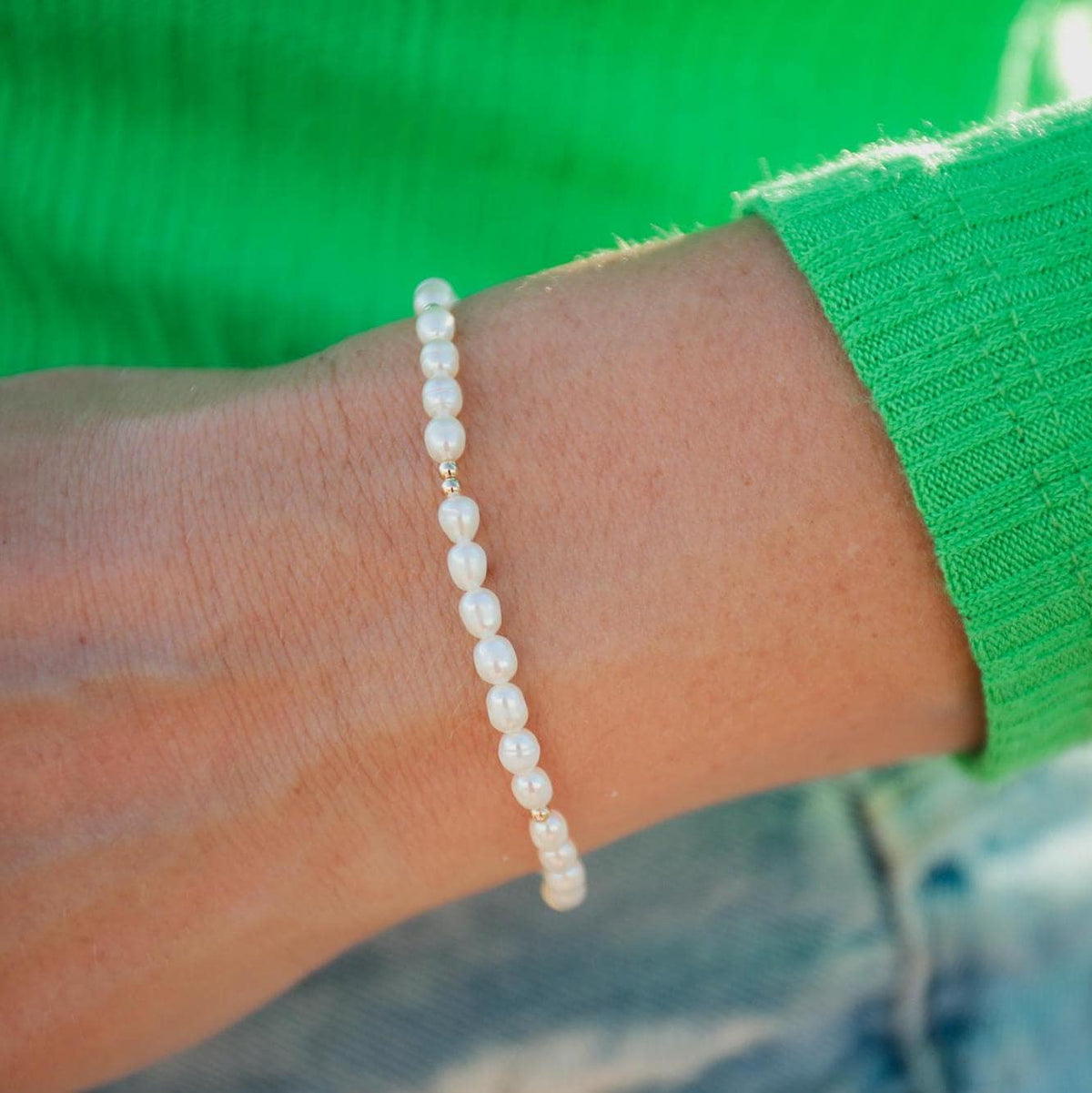 14K Pearl Mini jewelry piece from Earthly Abundance Jewelry featuring a small, elegant pearl on a delicate chain.