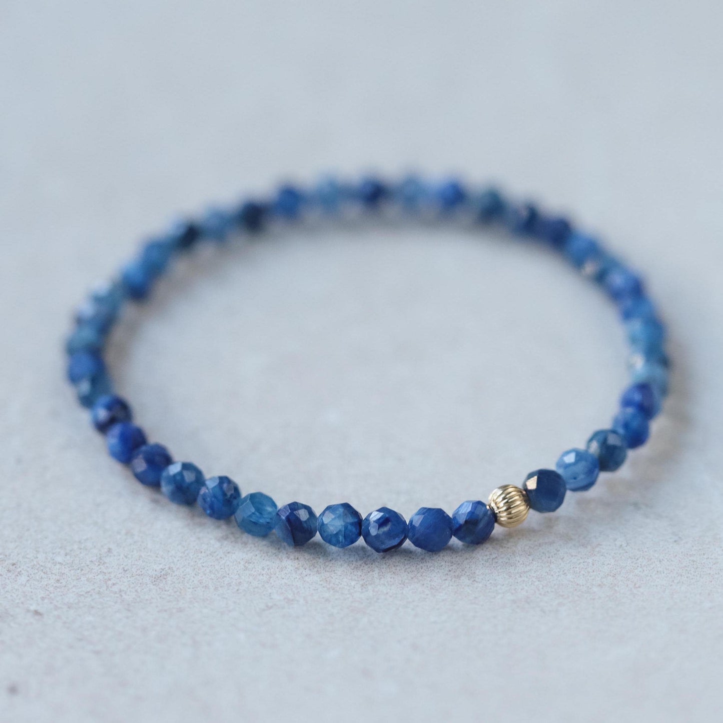 Spiritual Flow Kyanite bracelet with 14K gold accents from Earthly Abundance, featuring blue Kyanite beads for meditation and energy.
