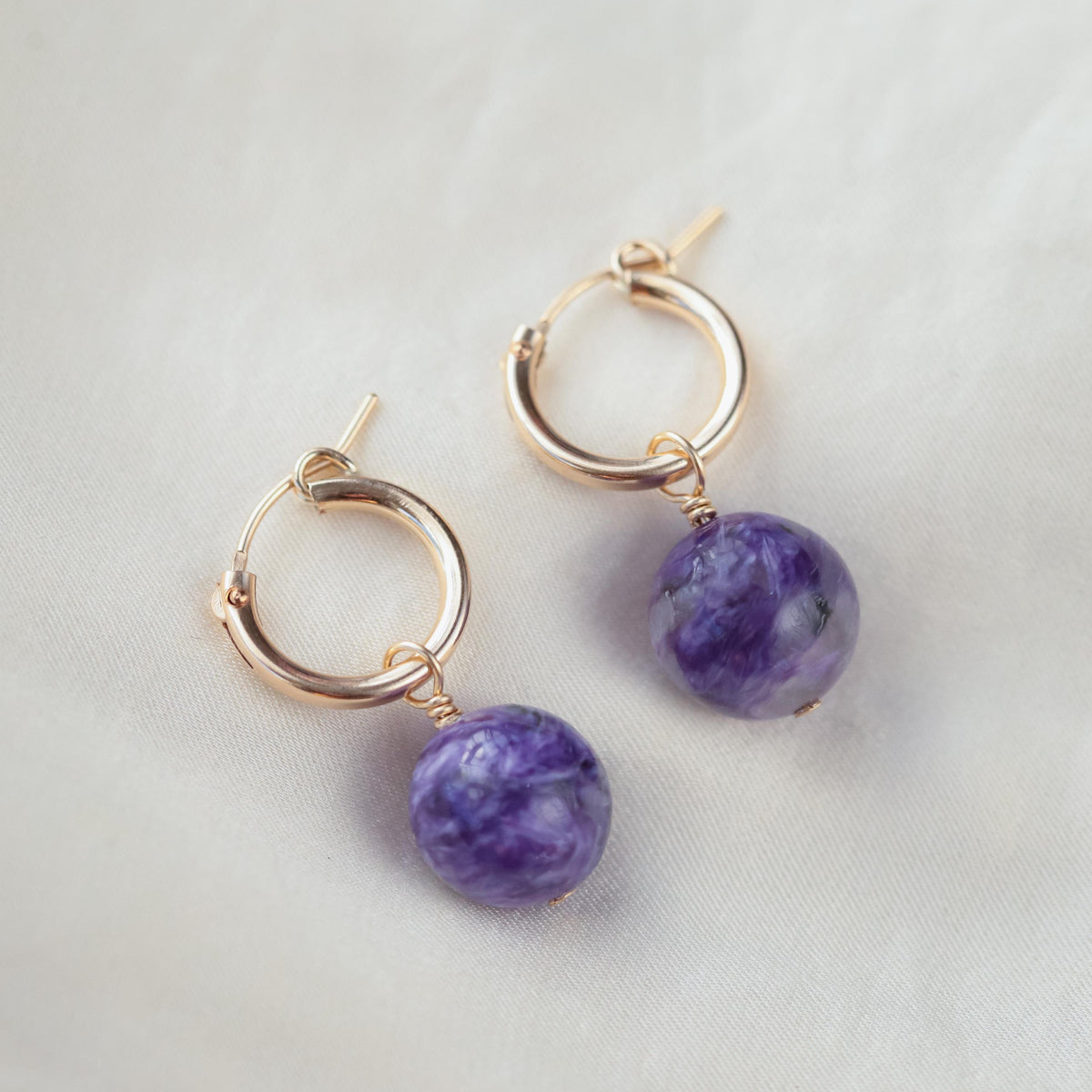 Charoite ball hoop earrings with 14K gold-filled hoops, featuring smooth, polished purple gemstone spheres for elegant jewelry.