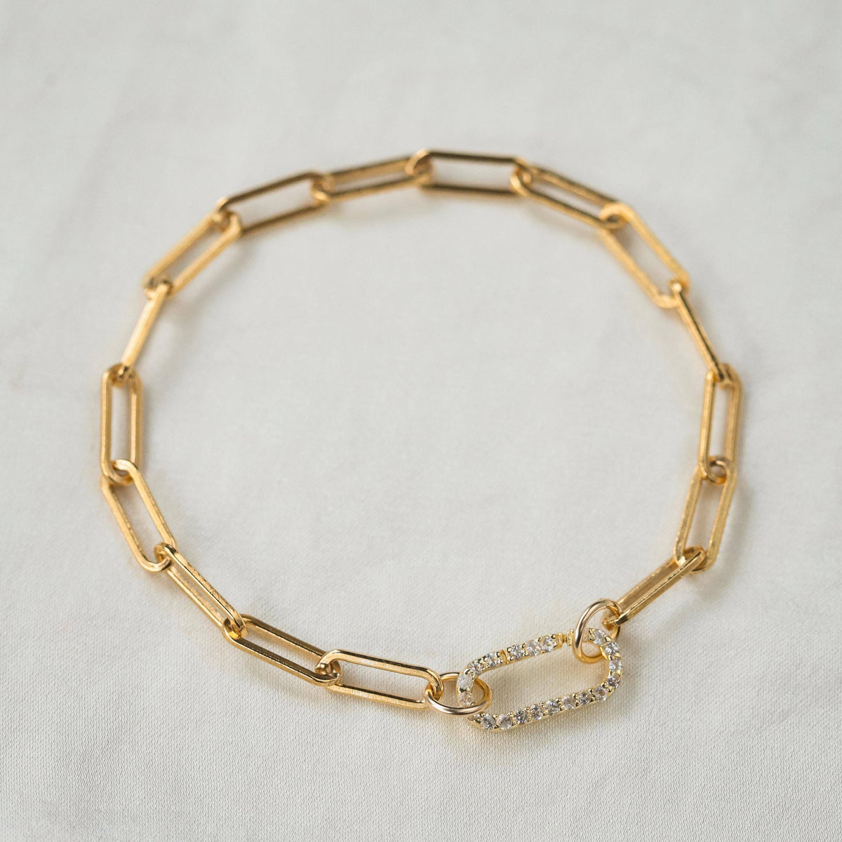 Earthly Abundance Jewelry paperclip carabiner bracelet with silver-toned links and secure clasp on a white background.
