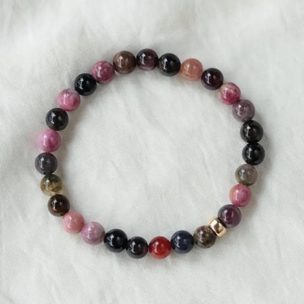 Mixed tourmaline bracelet with 14K gold accents from Earthly Abundance Jewelry, featuring colorful gemstone beads and elegant design.