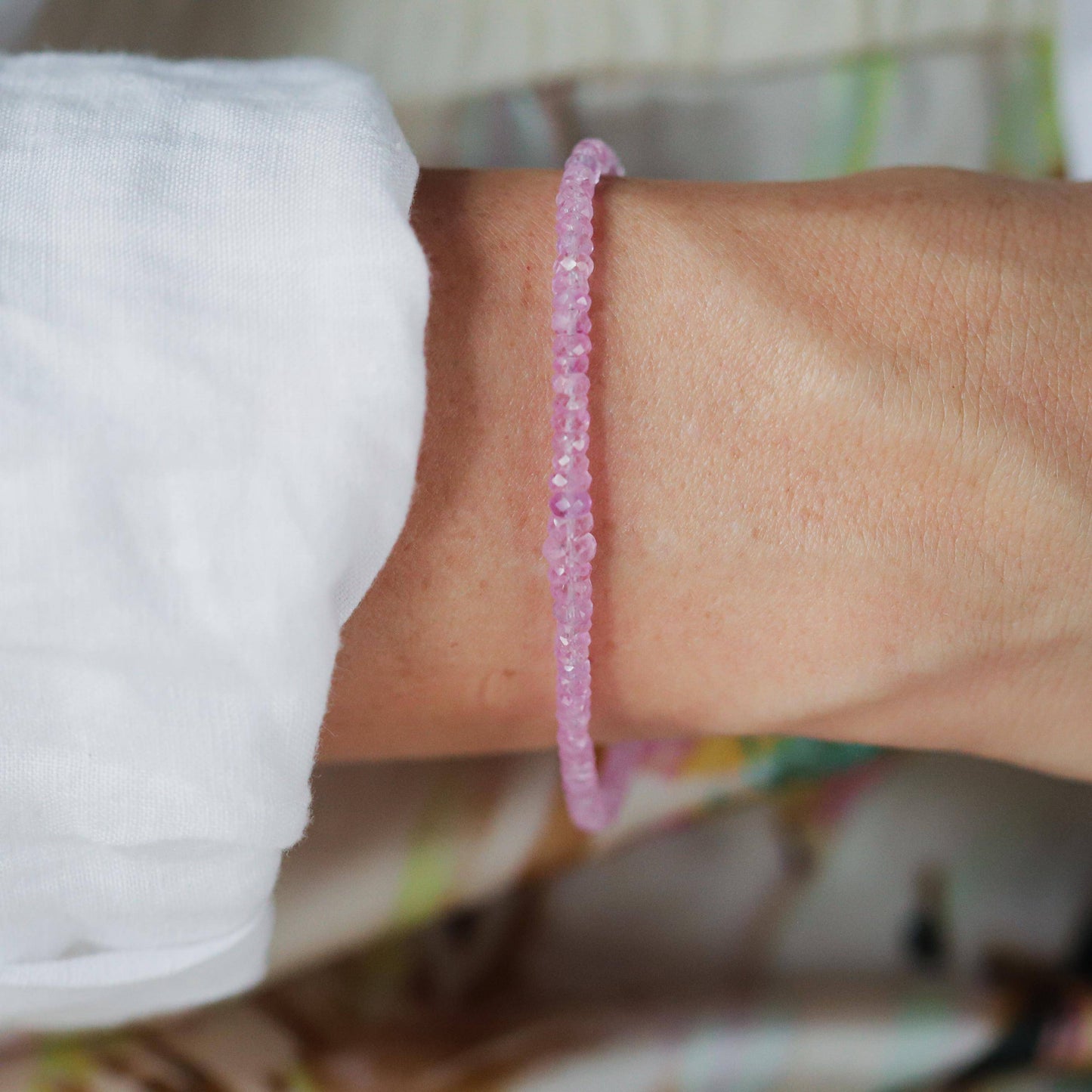 Baby pink sapphire bracelet in 14K gold featuring a delicate design, showcasing the elegant Earthly Abundance jewelry.
