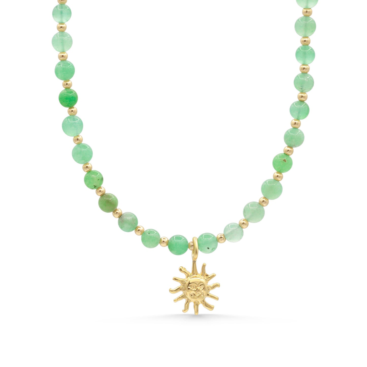 a green beaded necklace with a gold sun charm