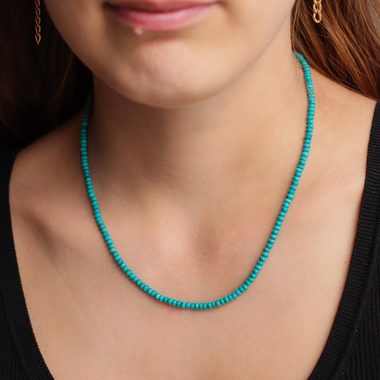 Earthly Abundance Jewelry Kingman turquoise necklace with 14K gold chain featuring vibrant blue turquoise stones.