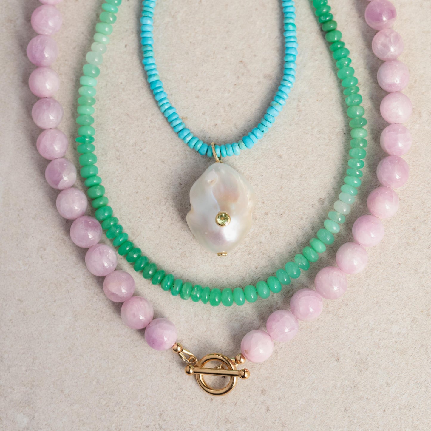 Green opal necklace with 14K gold setting, featuring a polished, oval-shaped gemstone on a delicate gold chain.