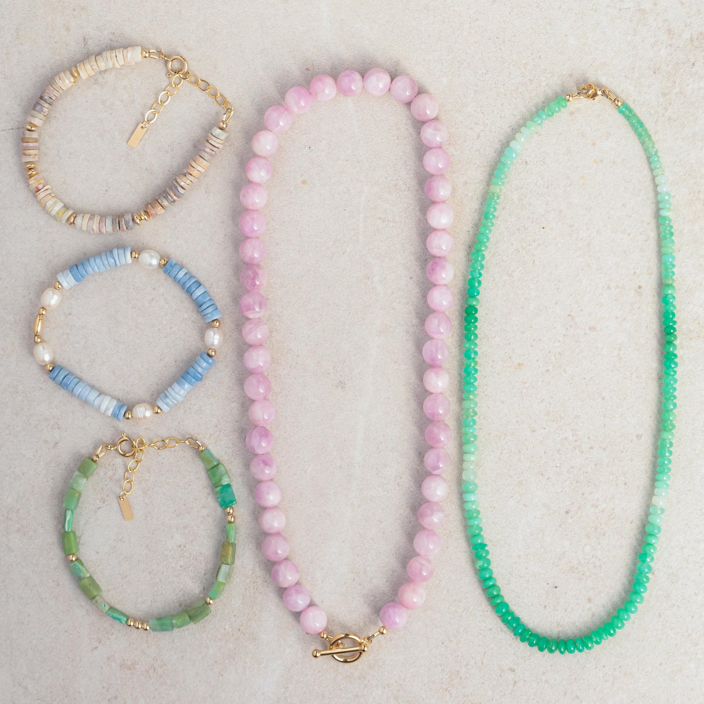Green opal necklace with 14K gold chain from Earthly Abundance, featuring a vibrant green gemstone pendant.