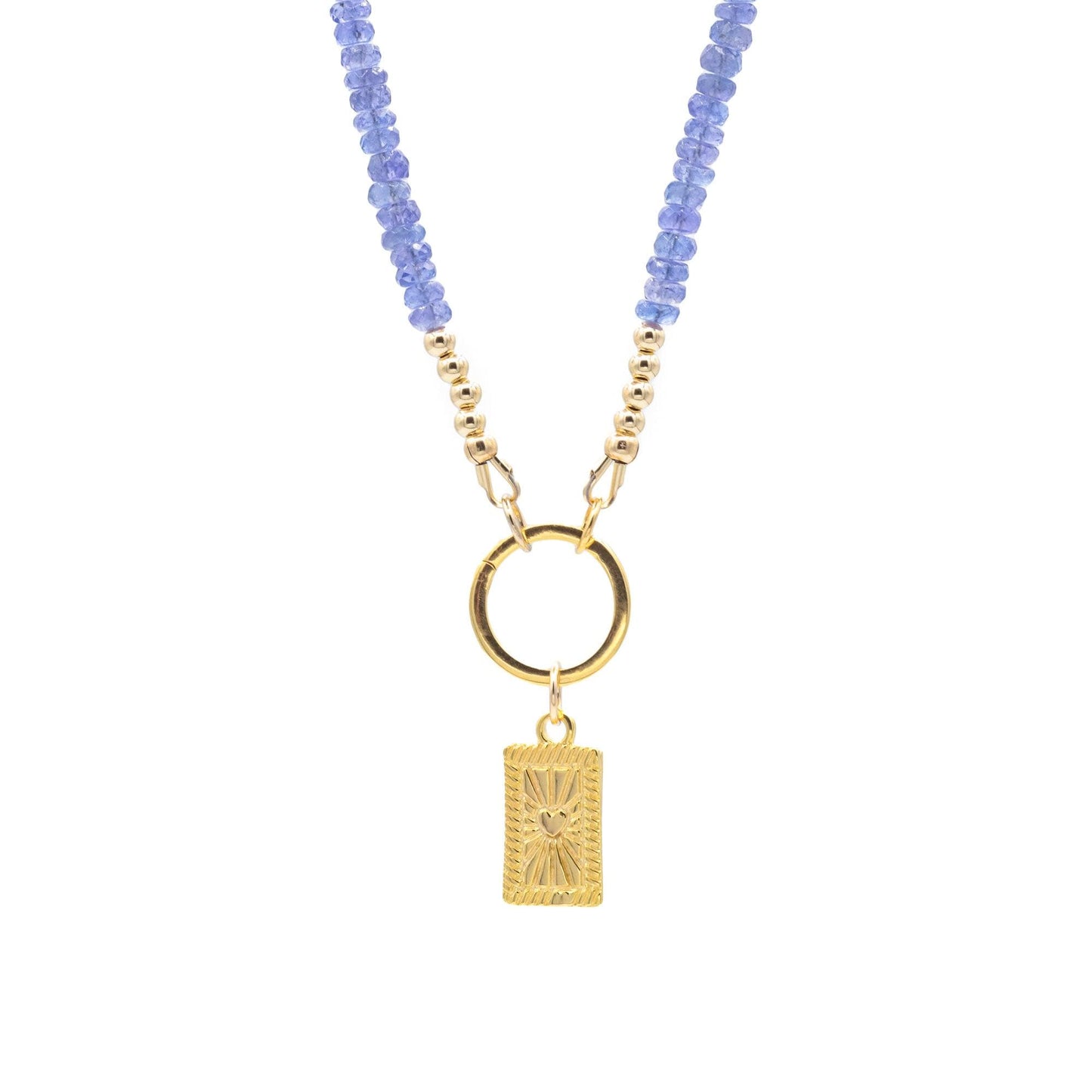 Tanzanite Aura Necklace featuring a vibrant tanzanite gemstone pendant on a silver chain, crafted by Earthly Abundance Jewelry.