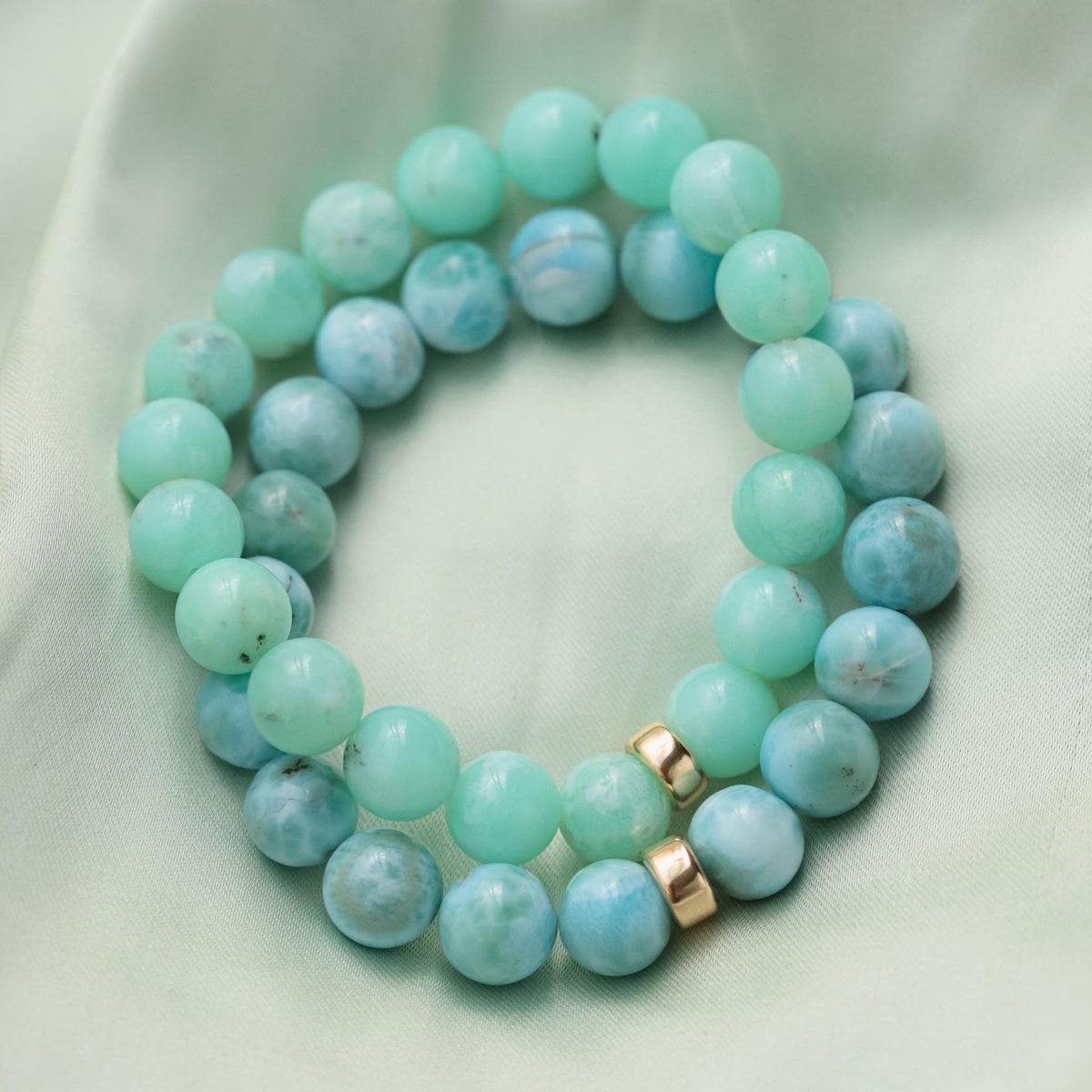 Larimar bracelet with 10mm stones and 14K gold accents from Earthly Abundance, showcasing the blue gemstone beads.