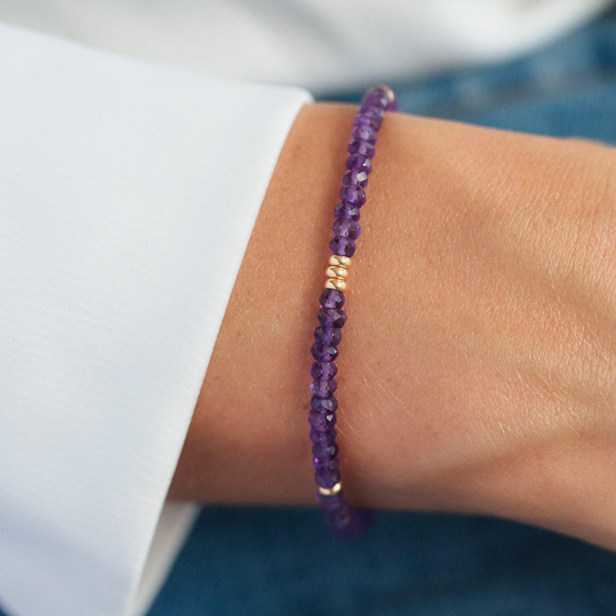 African Amethyst bracelet featuring polished purple amethyst beads on an elastic band, crafted by Earthly Abundance Jewelry.