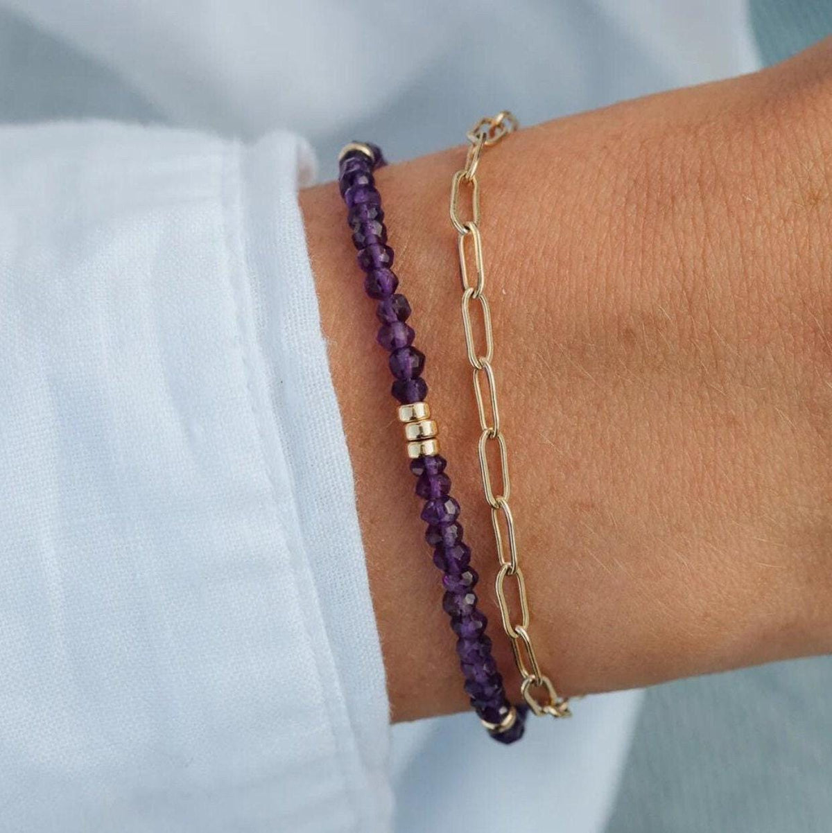 African Amethyst bracelet from Earthly Abundance Jewelry featuring polished purple amethyst beads on an elastic stretch cord.