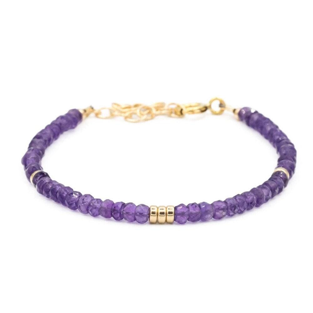African Amethyst bracelet featuring polished purple amethyst beads on a stretch cord, from Earthly Abundance Jewelry.