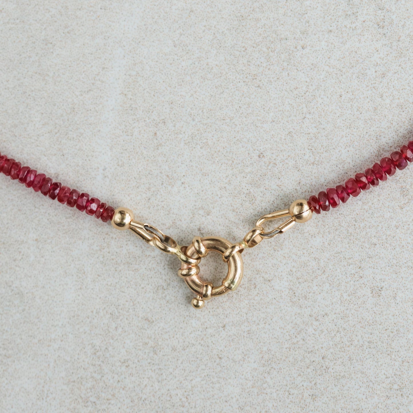 14K Anchor Ruby Necklace by Earthly Abundance featuring a sterling silver anchor pendant with a vibrant red ruby gemstone.