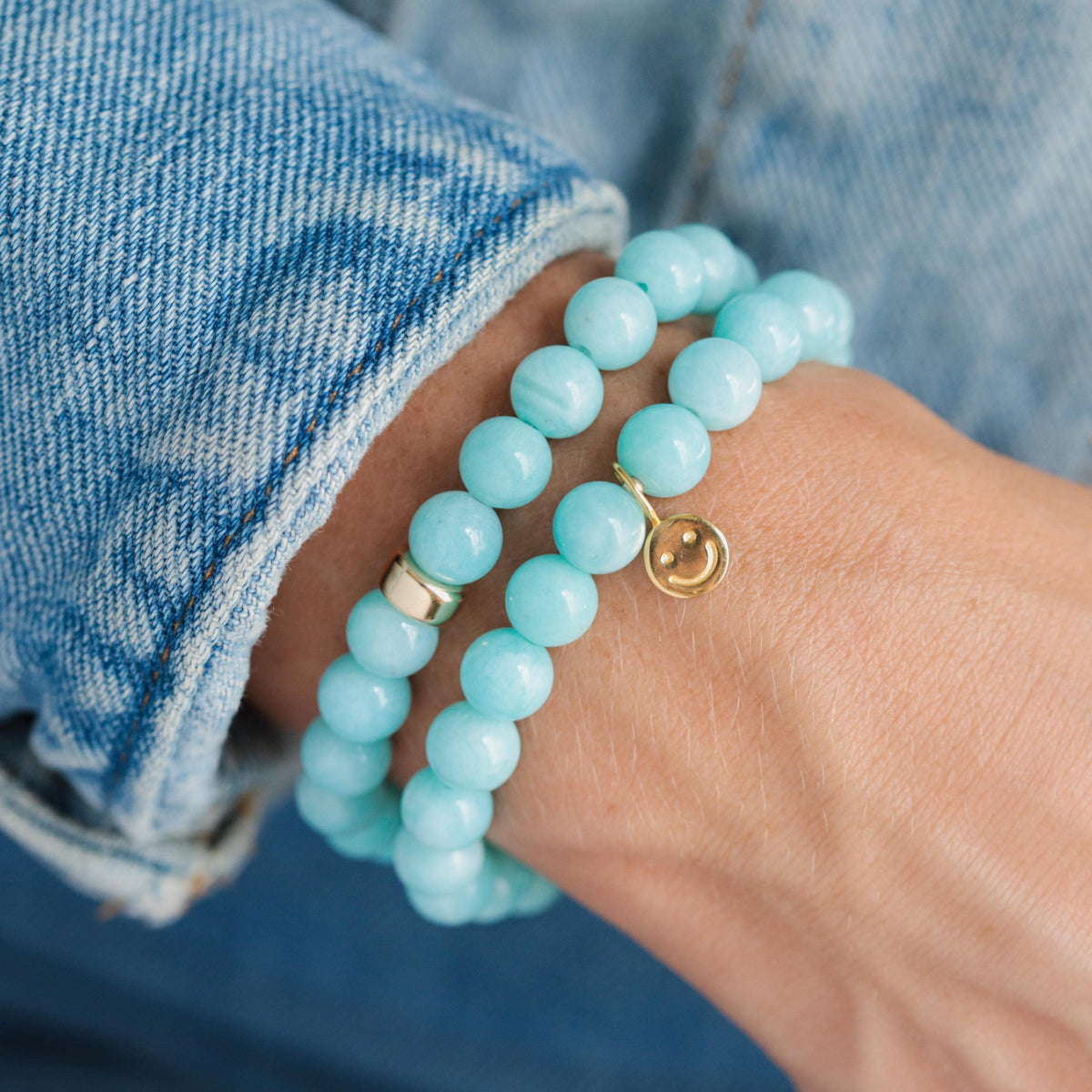 Peruvian Amazonite bracelet with polished blue-green stones from Earthly Abundance, featuring a beaded design on a neutral background.