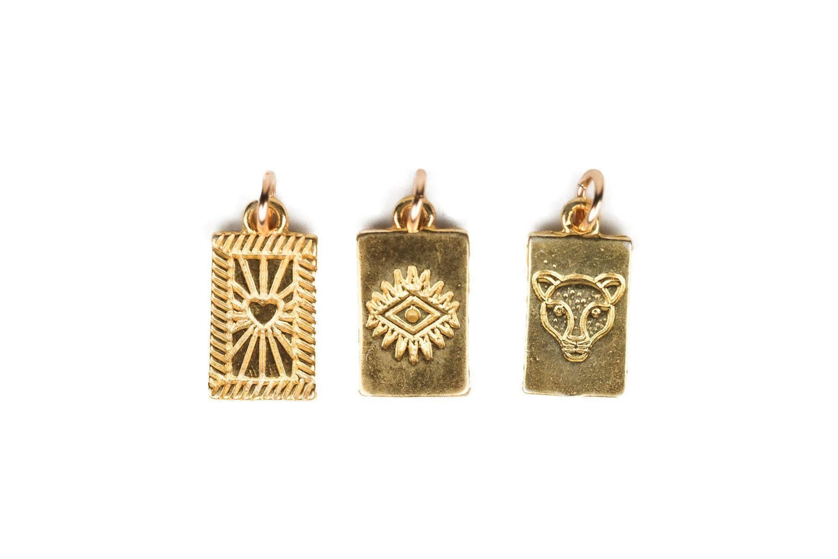 Gold vermeil pendant from Earthly Abundance featuring intricate design and a polished finish, displayed on a neutral background.