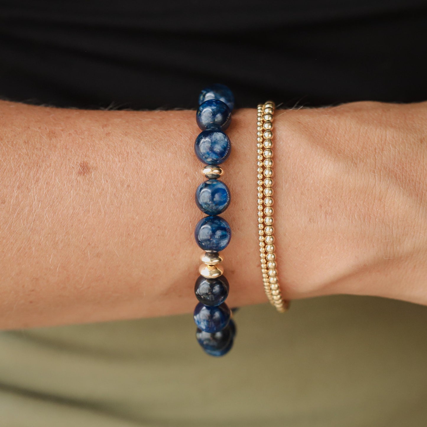 Earthly Abundance Jewelry 10mm Kyanite bracelet featuring polished blue gemstone beads on an elastic cord.