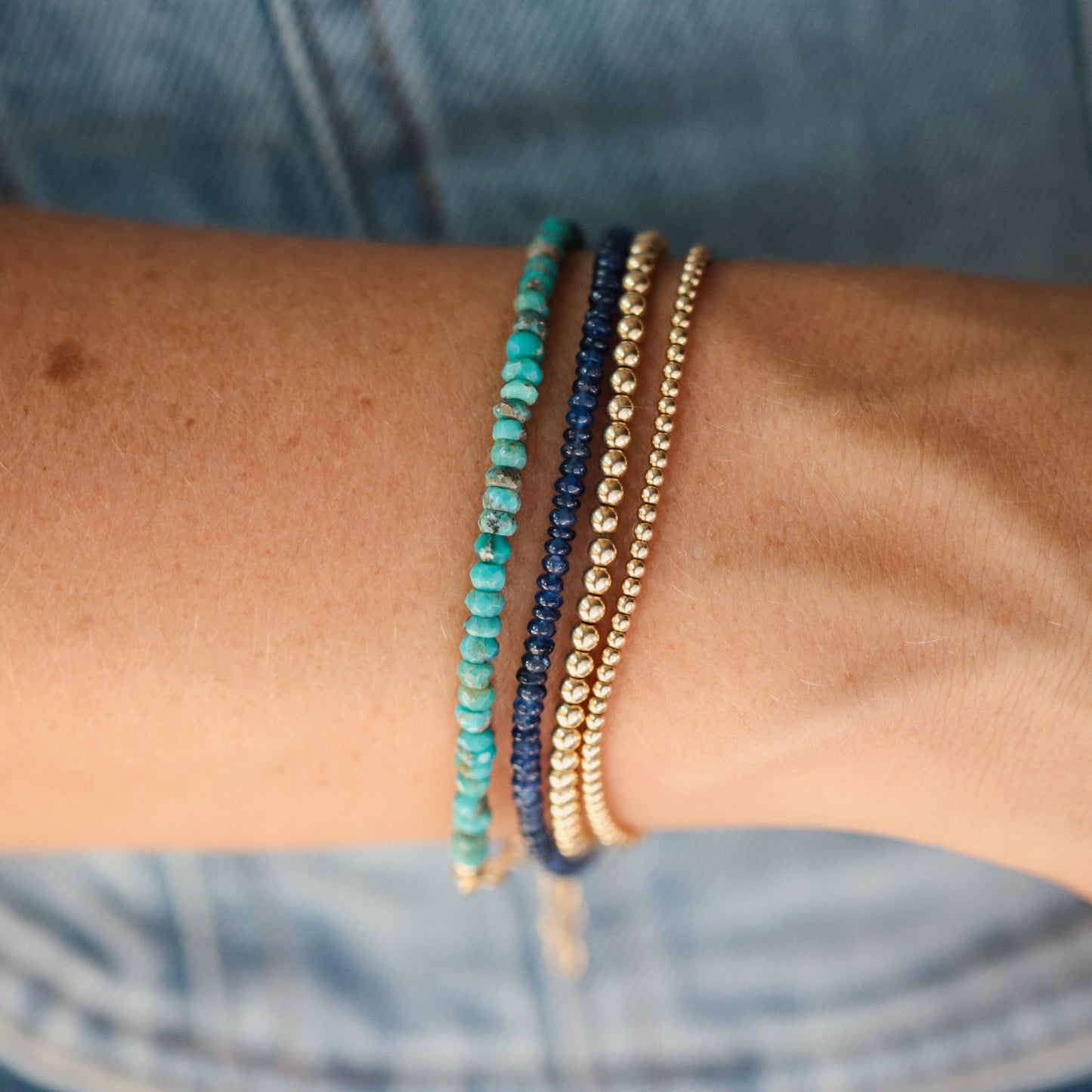 Blue sapphire rondel bracelet by Earthly Abundance featuring polished blue sapphire beads on a delicate string.