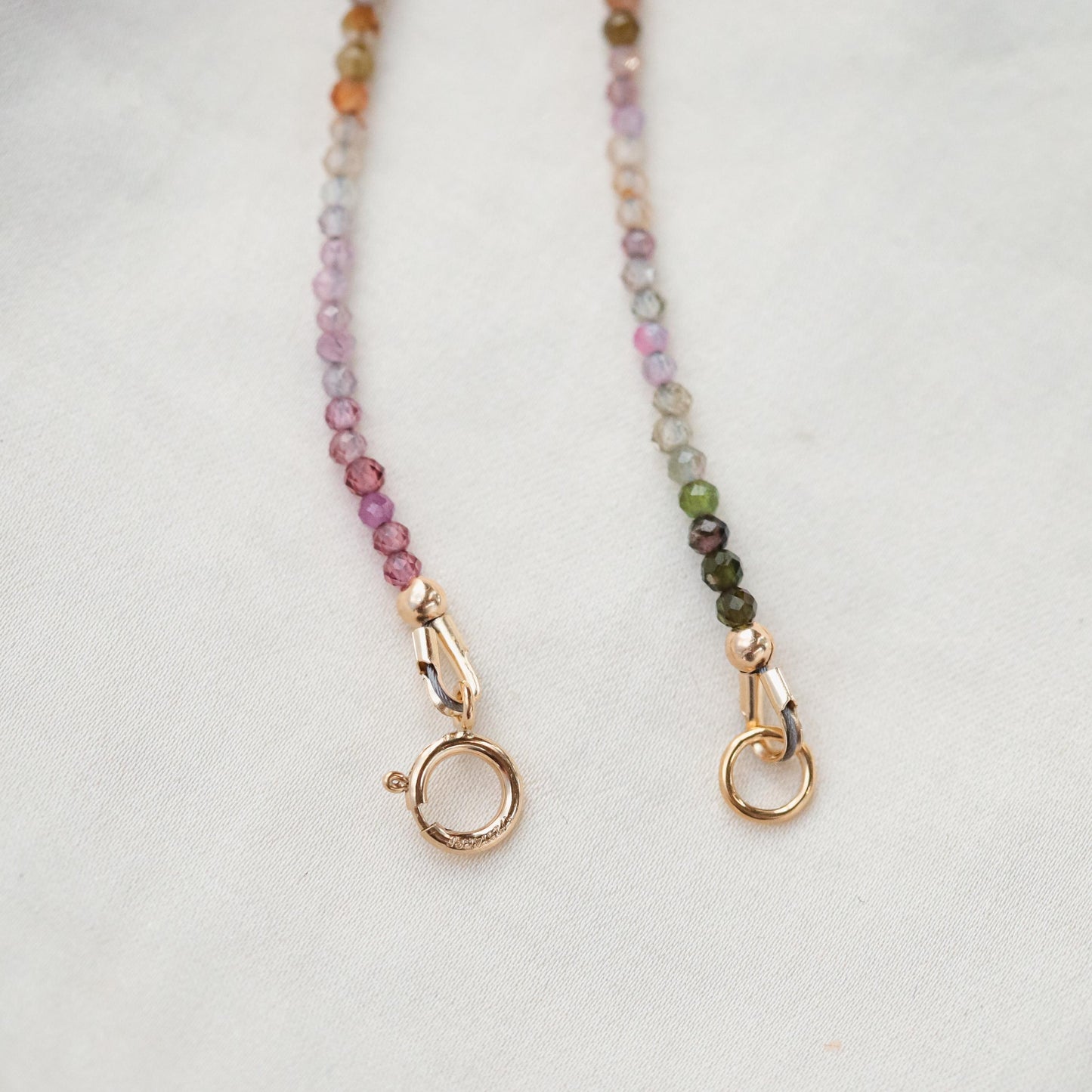 Mixed tourmaline necklace with 2mm beads from Earthly Abundance Jewelry, featuring colorful gemstones on a delicate chain.