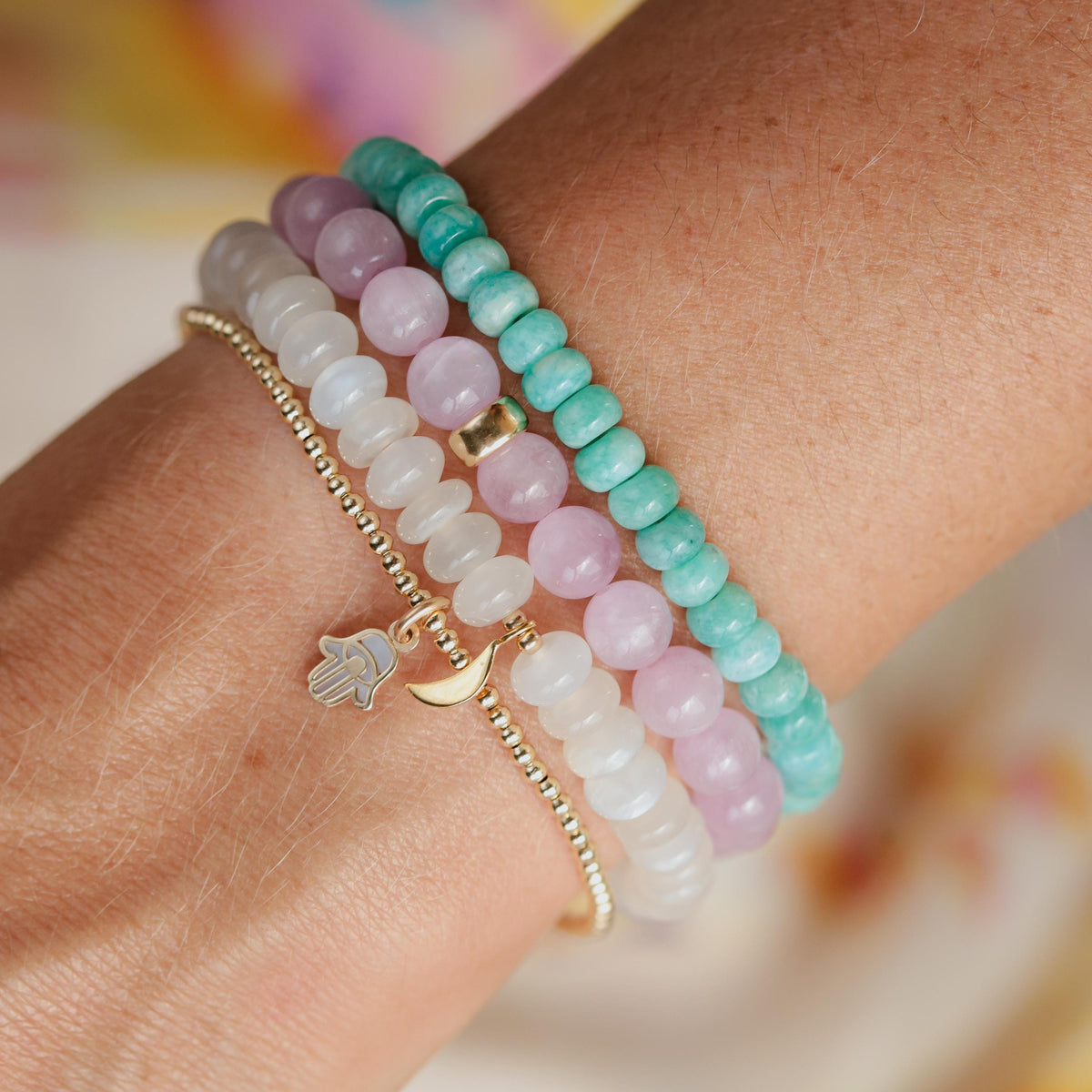 Kunzite bracelet with 7mm pink stones from Earthly Abundance, displayed on a white background with a silver clasp.
