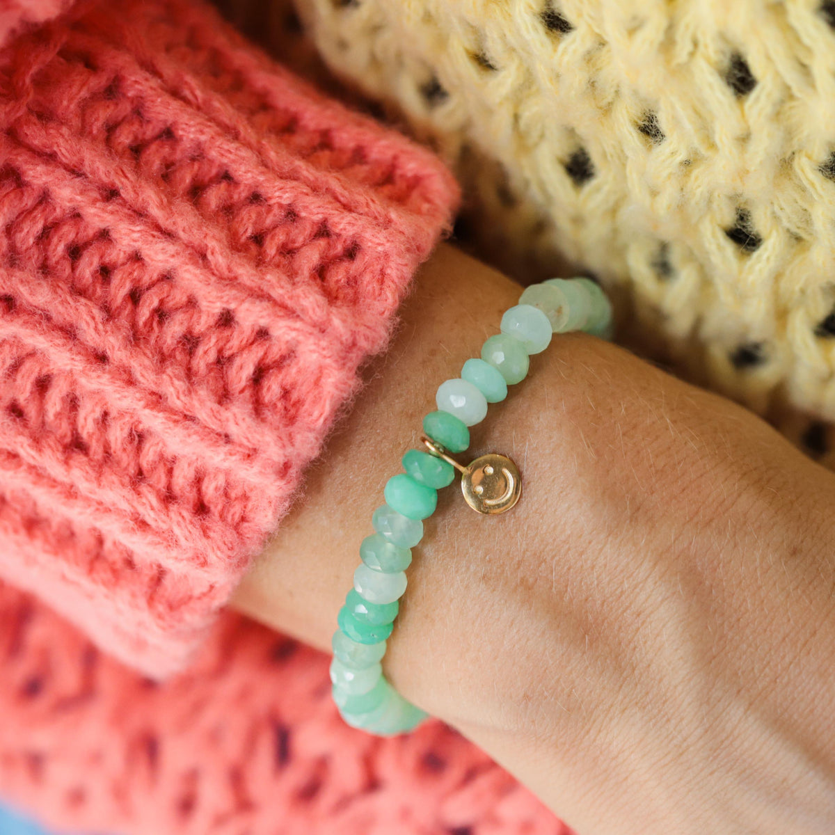Chrysoprase smiley bracelet from Earthly Abundance featuring green gemstone beads and a cheerful smiley charm.