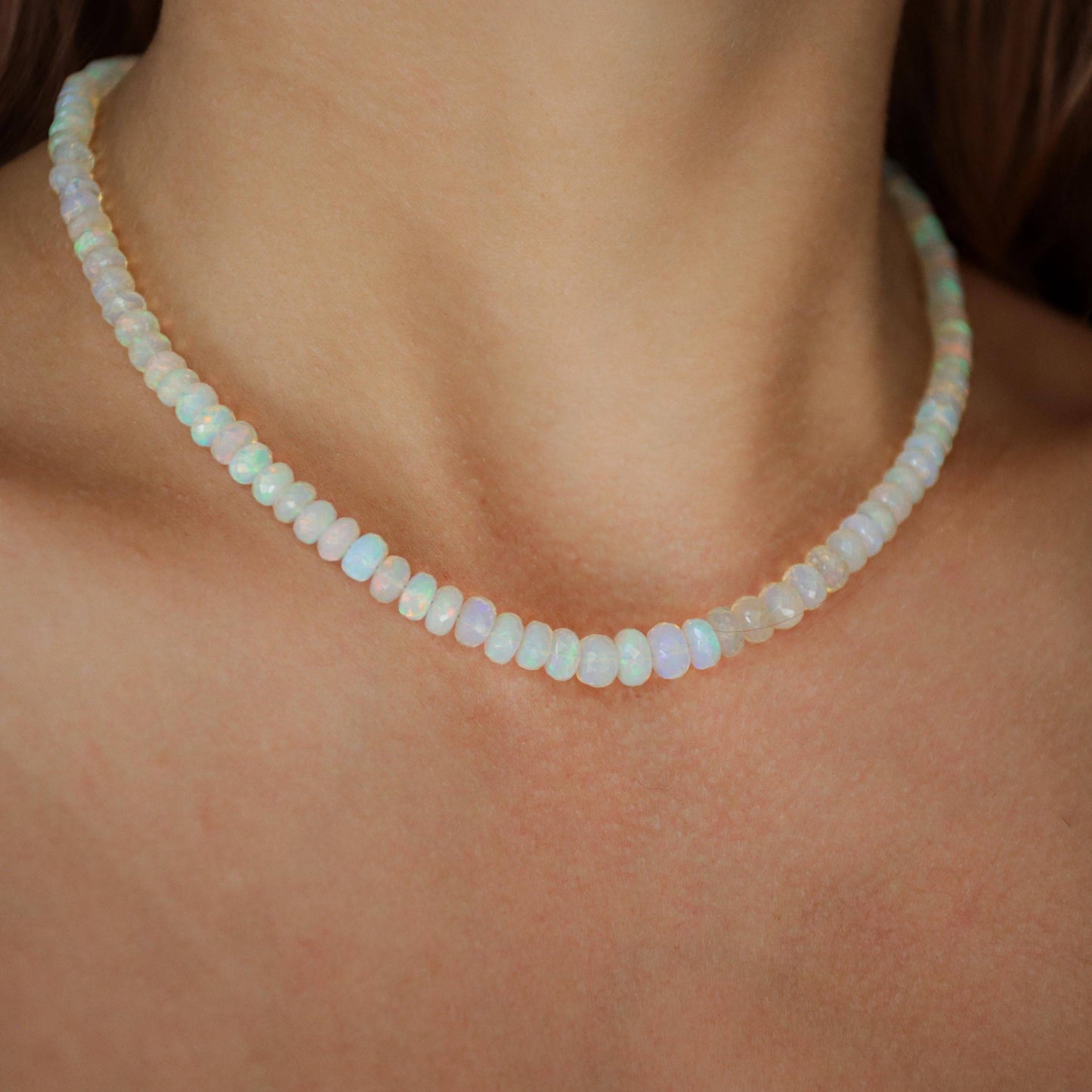 Ethiopian Opal beaded necklace with colorful gemstone beads and silver clasp by Earthly Abundance, displayed on a neutral background.