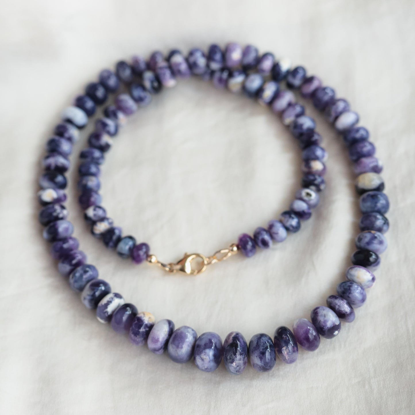 Purple opal necklace in 14K gold with a Tiffany-inspired design, featuring a sparkling gemstone pendant from Earthly Abundance.