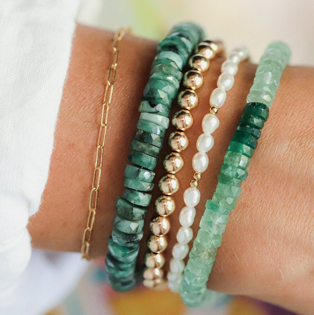 Green strawberry quartz Heishi bracelet featuring small, smooth quartz beads with a natural green hue, styled for casual wear.