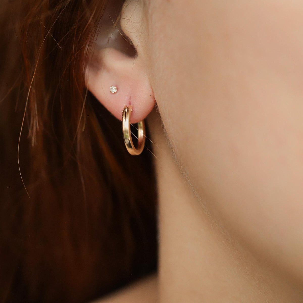 14K gold-filled hoop earrings from Earthly Abundance featuring sleek, minimalist design and polished gold finish.