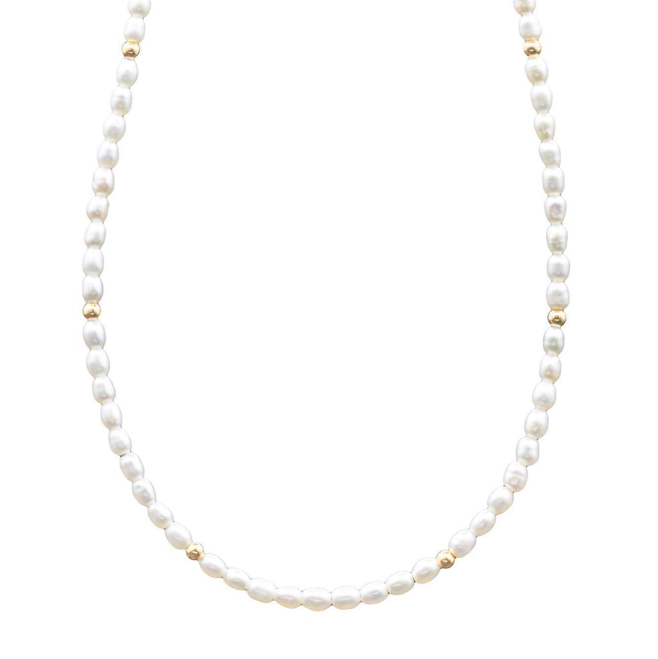 Freshwater pearl necklace with 14K gold clasp from Earthly Abundance, featuring lustrous white pearls on a delicate chain.