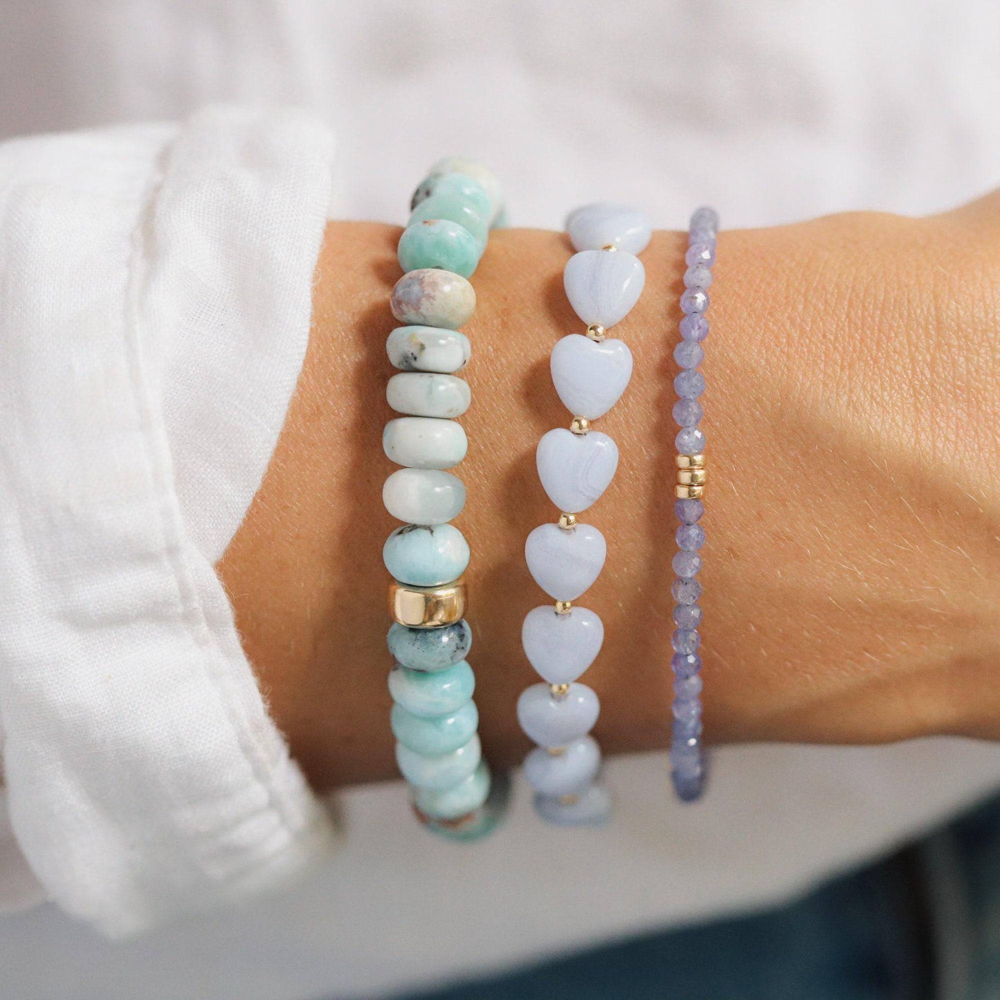 Larimar Smiley Bracelet by Earthly Abundance featuring a cheerful Larimar stone charm on a beaded bracelet.