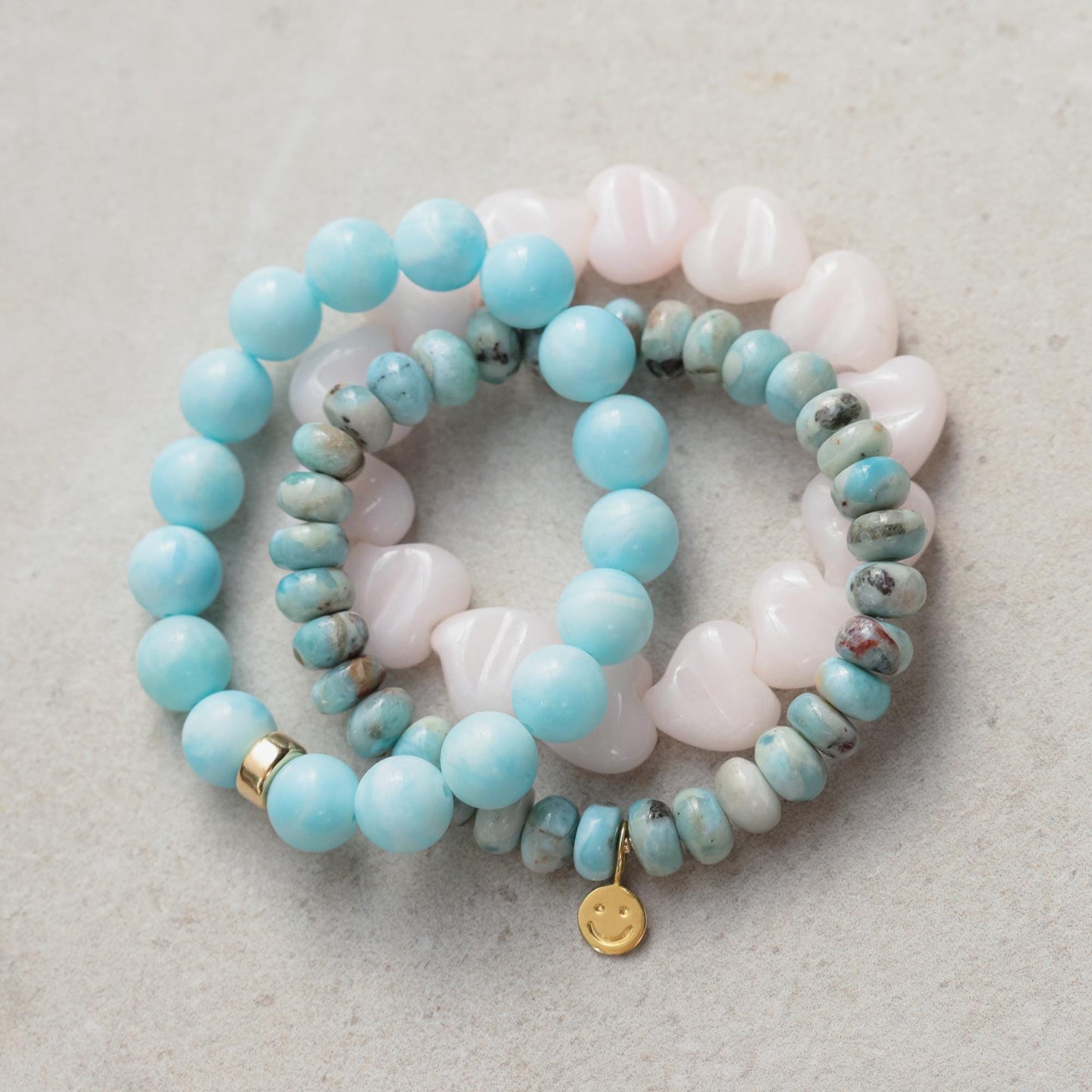 Larimar Depth bracelet by Earthly Abundance featuring smooth blue Larimar stones on a silver chain.