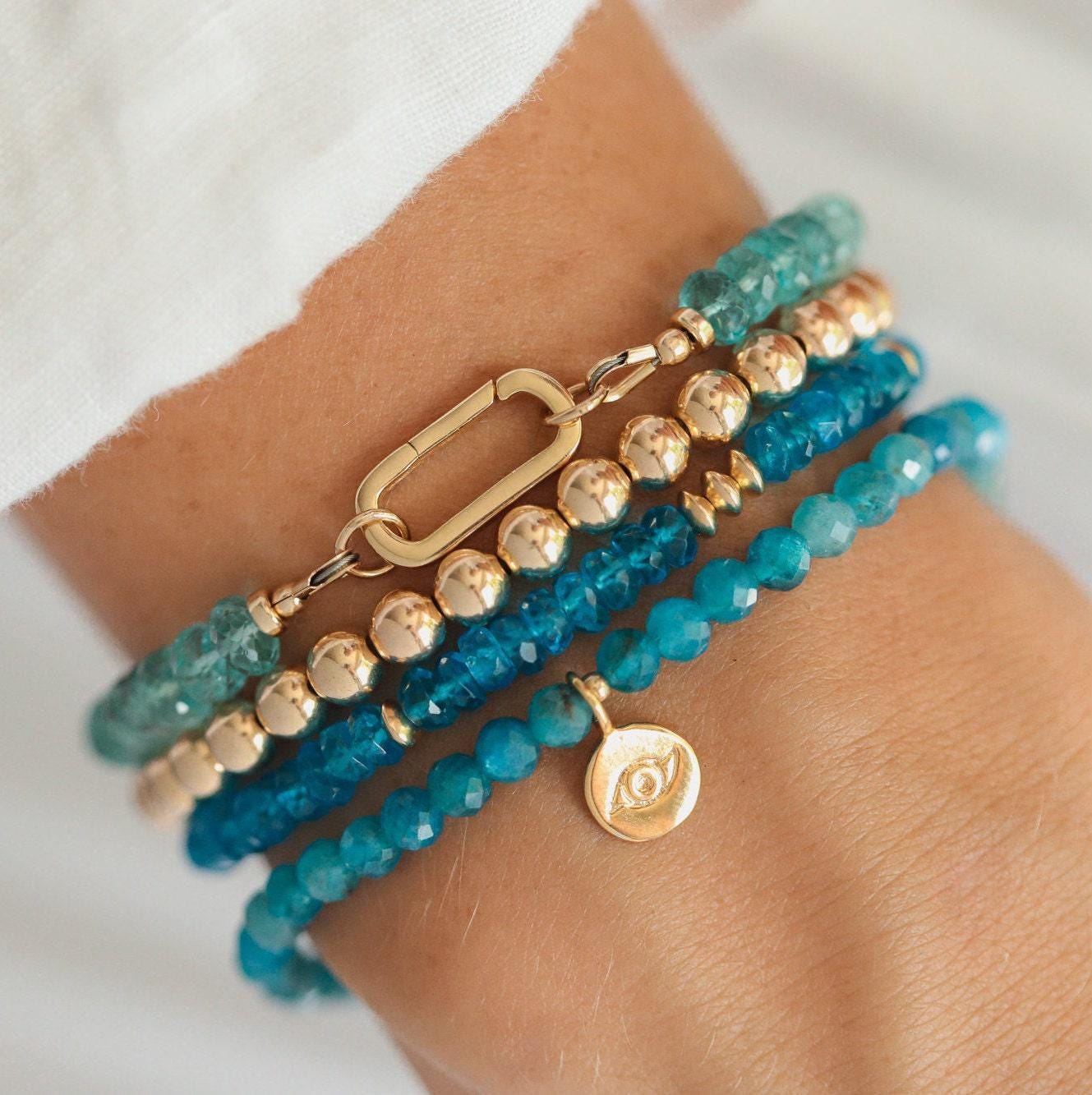 Aapatite bracelet with 14K gold clasp from Earthly Abundance, featuring smooth blue-green apatite gemstones on a delicate chain.