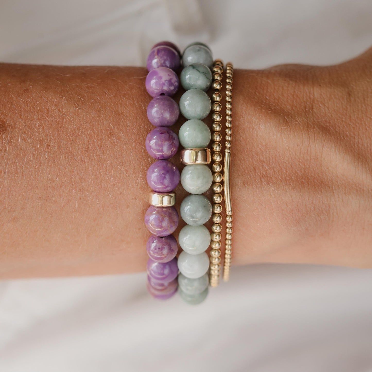 Burmese Jade 8mm gemstone beads from Earthly Abundance, showcasing smooth, polished green jade with natural variations.