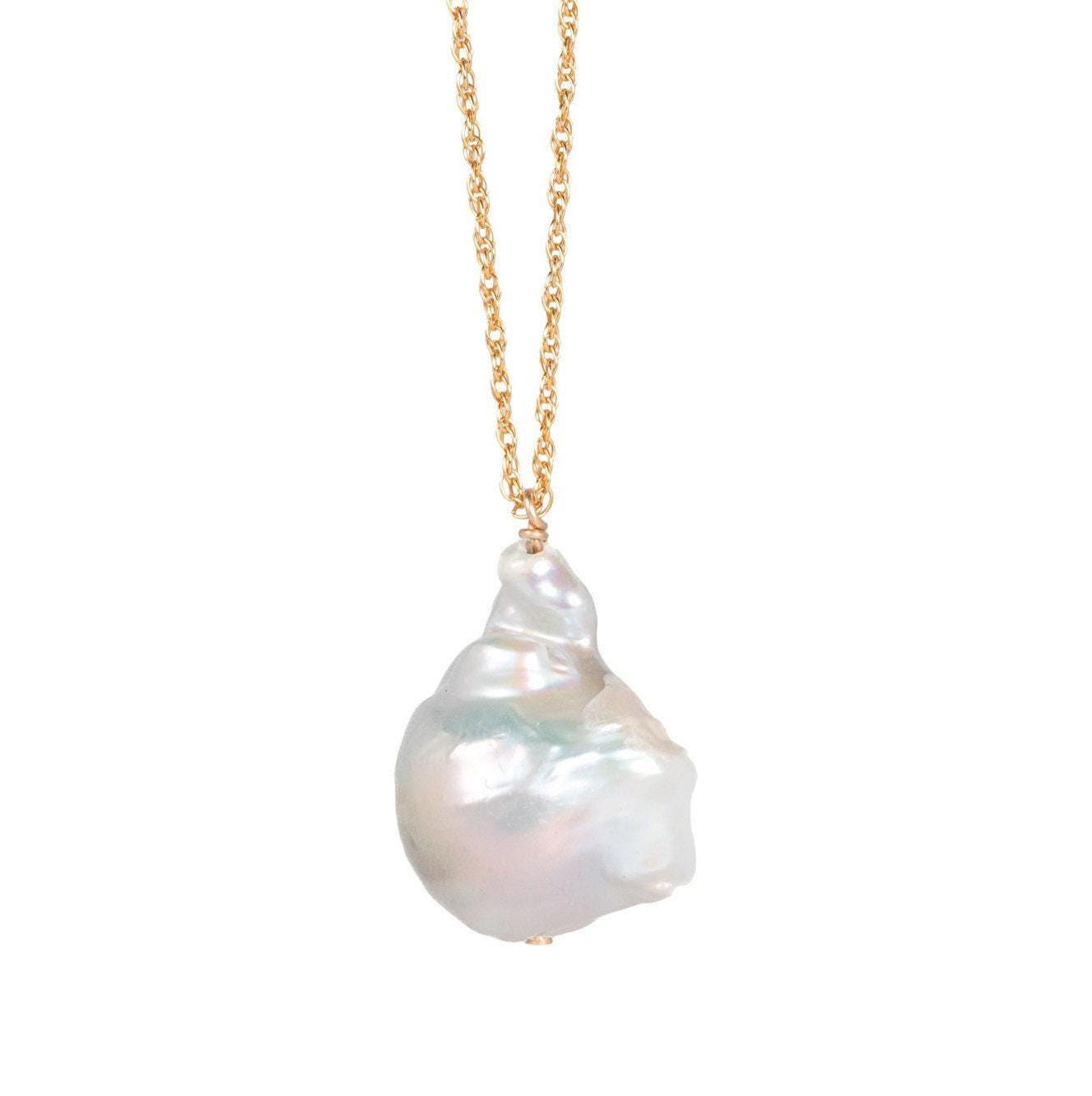 Elegant Baroque Pearl necklace by Earthly Abundance Jewelry featuring irregular freshwater pearls on a delicate chain.