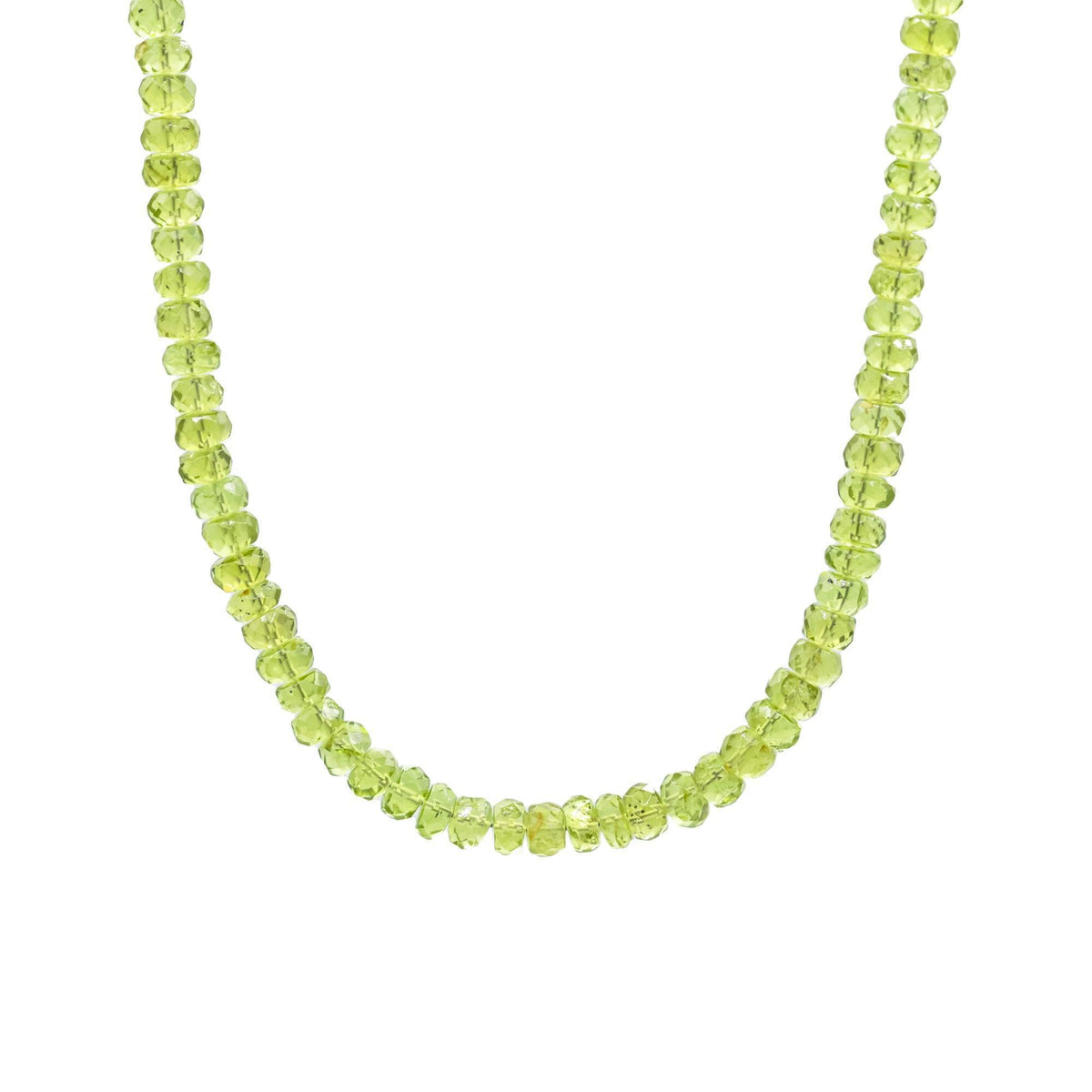 Peridot necklace featuring a 14K gold chain from Earthly Abundance, close-up of the vibrant green gemstone pendant.